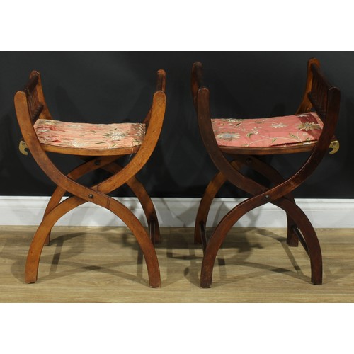 1399 - A pair of late 19th century campaign type folding X-frame stools, each with two settings, adjustable... 