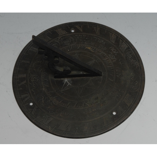 1075 - A bronze sundial, inscribed Set Me Right And Use Me Well/And I The Time To You Will Tell, 18cm diam,... 