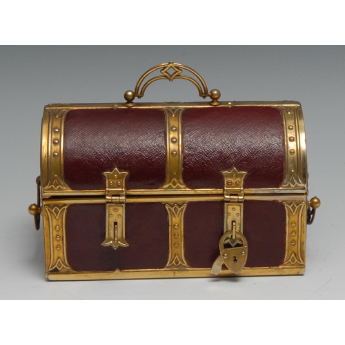 1153 - An early 20th century brass mounted red morocco leather sewing casket, as a domed trunk, the hinged ... 