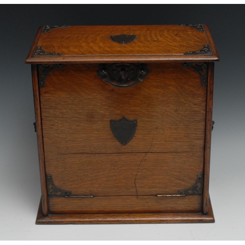 1392 - A Victorian oak table top writing cabinet, fall front enclosing a tooled and gilt writing surface, i... 