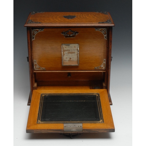 1392 - A Victorian oak table top writing cabinet, fall front enclosing a tooled and gilt writing surface, i... 