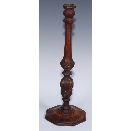 1389 - A pair of 19th century parcel-gilt walnut octagonal table candlesticks, campana sconces, turned and ... 