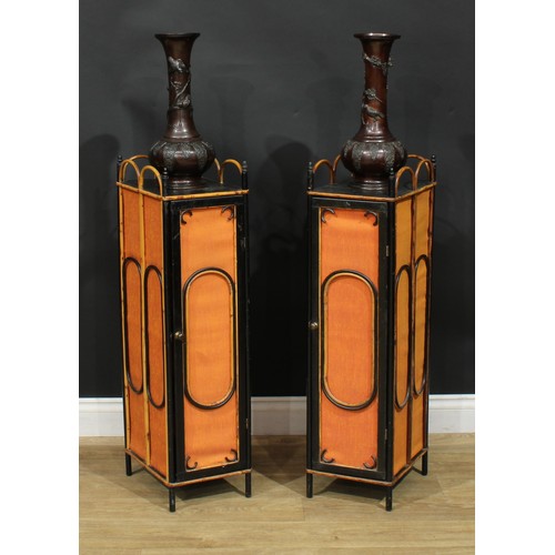 1375 - A pair of Aesthetic Movement bamboo and parcel-ebonised pedestal cabinets, each with three-quarter l... 