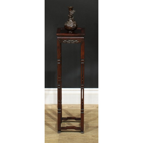 1045 - A Chinese hardwood vase stand, square panel top, shaped frieze pierced and carved with lotus, pierce... 