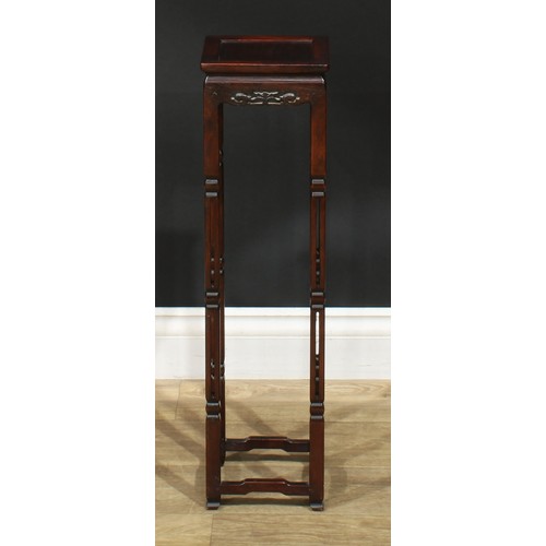 1045 - A Chinese hardwood vase stand, square panel top, shaped frieze pierced and carved with lotus, pierce... 