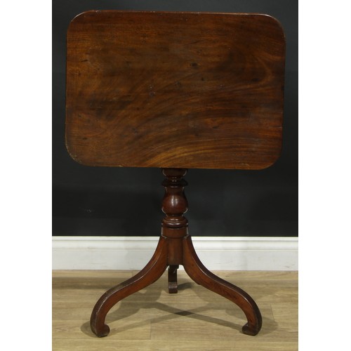 939 - A 19th century mahogany tripod occasional table, rounded rectangular tilting top, turned column, dow... 