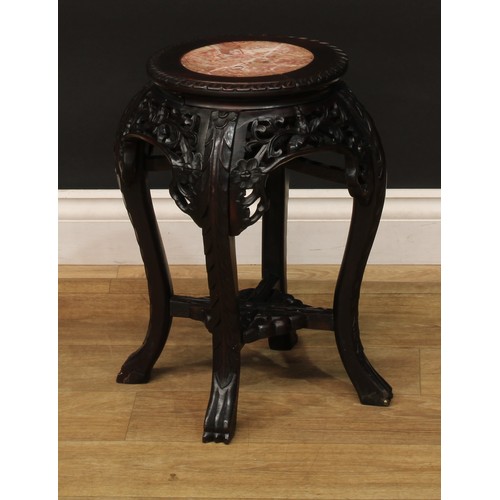 1028 - A Chinese hardwood jardiniere stand, circular top with inset marble panel, pierced and carved with l... 