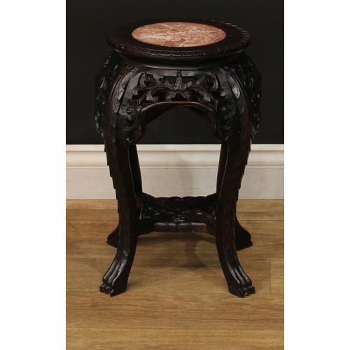 1028 - A Chinese hardwood jardiniere stand, circular top with inset marble panel, pierced and carved with l... 