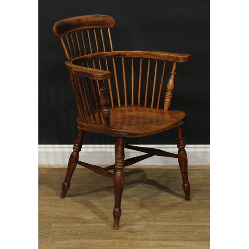 888 - A 19th century ash and elm Windsor elbow chair, low comb back with curved cresting rail, curved arm ... 