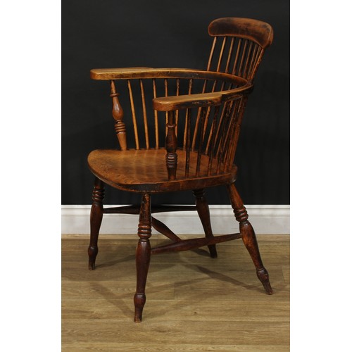 888 - A 19th century ash and elm Windsor elbow chair, low comb back with curved cresting rail, curved arm ... 