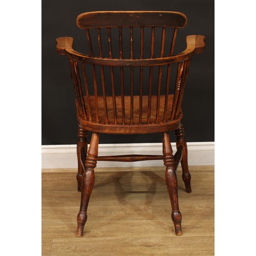 888 - A 19th century ash and elm Windsor elbow chair, low comb back with curved cresting rail, curved arm ... 