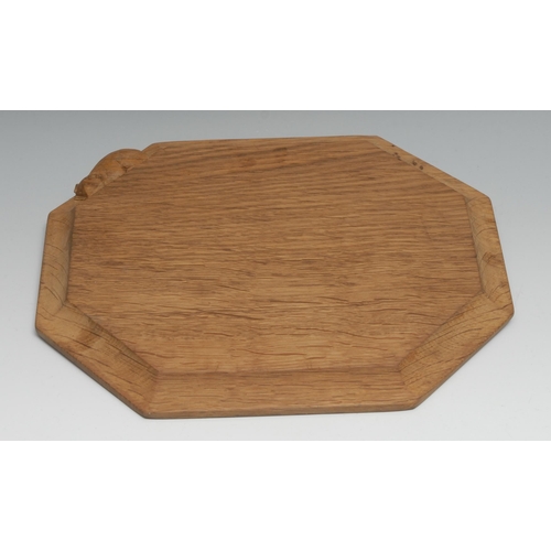 1632 - Mouseman of Kilburn - an oak octagonal bread board, adzed overall, carved mouse signature, 30.5cm x ... 