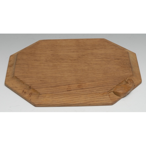 1632 - Mouseman of Kilburn - an oak octagonal bread board, adzed overall, carved mouse signature, 30.5cm x ... 