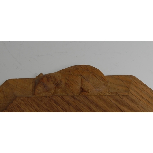 1632 - Mouseman of Kilburn - an oak octagonal bread board, adzed overall, carved mouse signature, 30.5cm x ... 