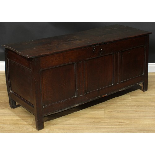 1015 - A Charles II oak blanket chest, hinged top above a three panel front, stile feet, 65cm high, 142cm w... 