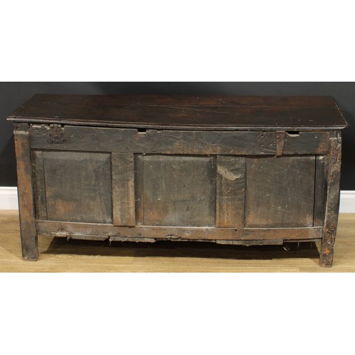 1015 - A Charles II oak blanket chest, hinged top above a three panel front, stile feet, 65cm high, 142cm w... 