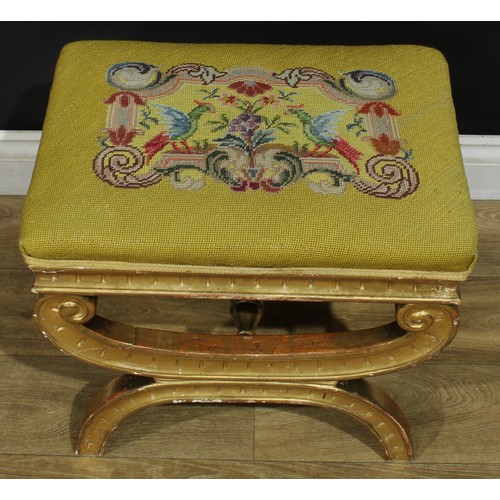 1012 - A Baroque Revival giltwood stool, stuffed-over tapestry seat brightly worked with parrots pecking fr... 