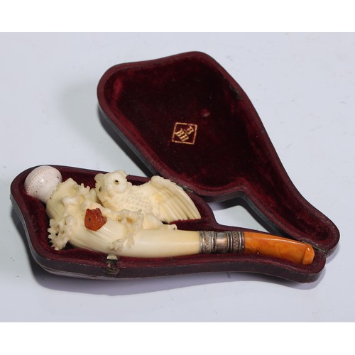 1263 - A late 19th century meerschaum pipe, carved as an owl perched on branch, an amber owlet peering out ... 