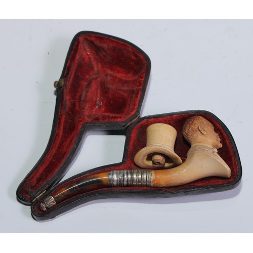 1262 - A late 19th century meerschaum pipe, carved as a gentleman, bust length, his top hat en suite, 12cm ... 