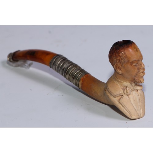 1262 - A late 19th century meerschaum pipe, carved as a gentleman, bust length, his top hat en suite, 12cm ... 