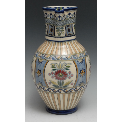 386 - A large Zsolnay Pecs ovoid jug or ewer, decorated in polychrome in the Persian taste, 32cm high, blu... 