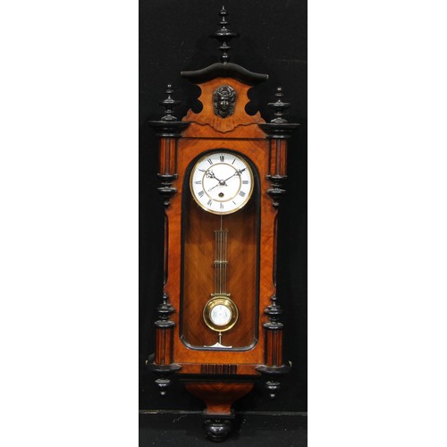 978 - A 19th century walnut and ebonised Vienna timepiece, 13cm enamel clock dial inscribed with Roman num... 