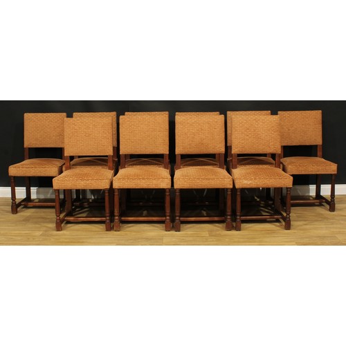 1130 - A set of twelve late Victorian Cromwellian Revival oak dining chairs, by Howard & Sons, comprising t... 