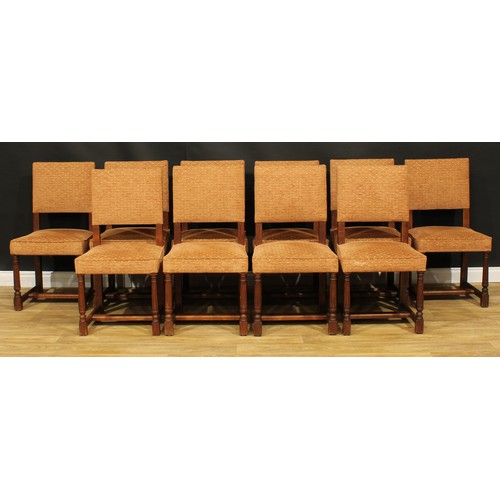 1130 - A set of twelve late Victorian Cromwellian Revival oak dining chairs, by Howard & Sons, comprising t... 