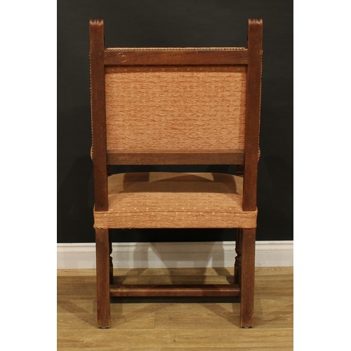 1130 - A set of twelve late Victorian Cromwellian Revival oak dining chairs, by Howard & Sons, comprising t... 