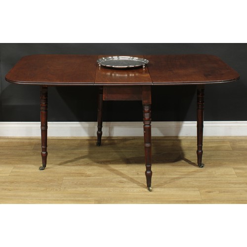 1431 - A Regency mahogany gateleg table, rounded rectangular top with channelled edge and fall leaves, ring... 