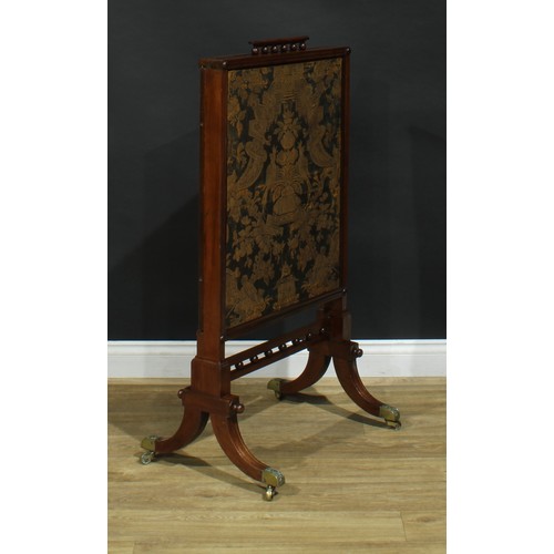 1430 - A Regency mahogany extending fire screen, rectangular frame with channelled edge, sabre legs, brass ... 