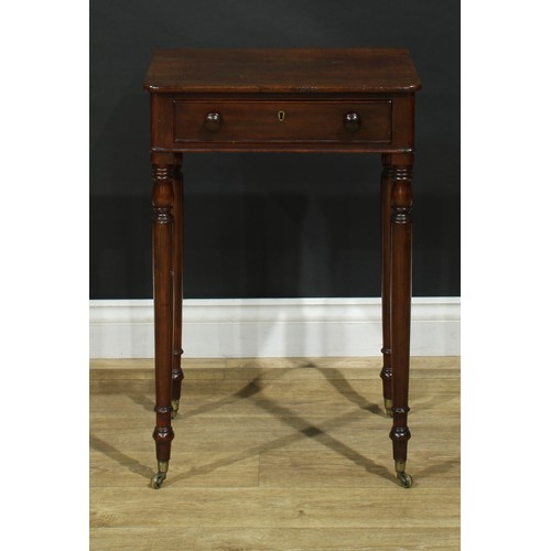 1439 - A Regency mahogany work table, rounded rectangular top above a long cockbeaded frieze drawer, ring-t... 