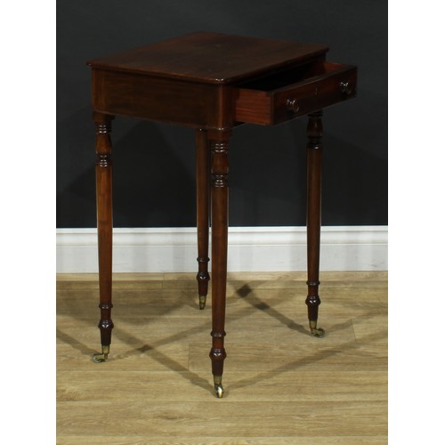 1439 - A Regency mahogany work table, rounded rectangular top above a long cockbeaded frieze drawer, ring-t... 