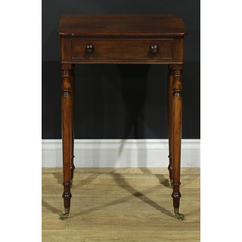 1439 - A Regency mahogany work table, rounded rectangular top above a long cockbeaded frieze drawer, ring-t... 