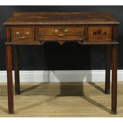 1165 - A George III oak lowboy or side table, rectangular top above three frieze drawers, moulded internall... 