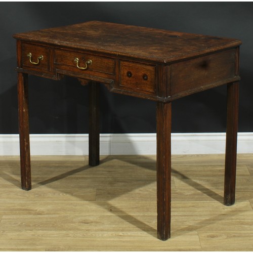 1165 - A George III oak lowboy or side table, rectangular top above three frieze drawers, moulded internall... 