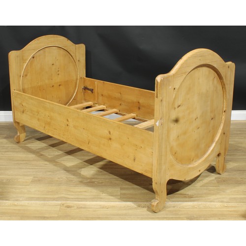 1297 - A late 19th century Austrian pine single bed, the headboard 107cm high, the internal 178cm x 87cm