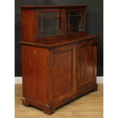 922 - A 19th century mahogany dining room press cabinet, rectangular superstructure with two doors, the pr... 