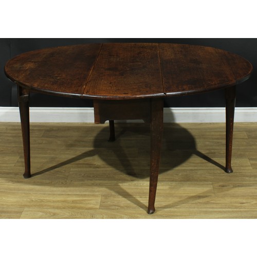 1093 - A George II oak gateleg table, oval top with fall leaves, straightened cabriole legs, 68cm high, 42c... 