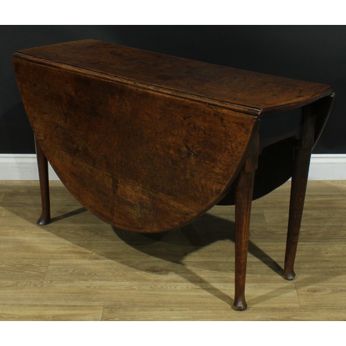 1093 - A George II oak gateleg table, oval top with fall leaves, straightened cabriole legs, 68cm high, 42c... 