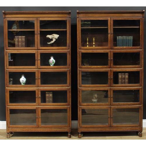 1382 - A pair of early 20th century oak modular stacking barrister’s bookcases, by Minty Limited, Library S... 