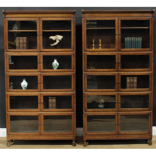 1382 - A pair of early 20th century oak modular stacking barrister’s bookcases, by Minty Limited, Library S... 