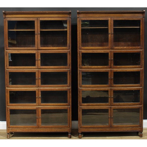 1382 - A pair of early 20th century oak modular stacking barrister’s bookcases, by Minty Limited, Library S... 