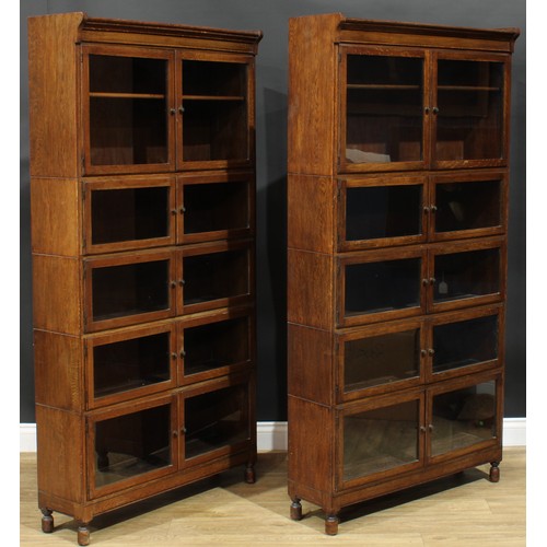 1382 - A pair of early 20th century oak modular stacking barrister’s bookcases, by Minty Limited, Library S... 