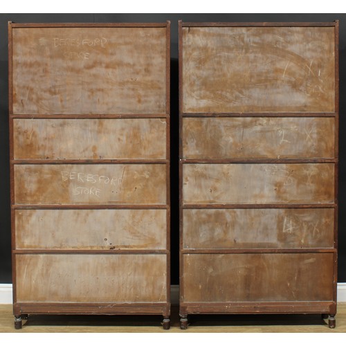 1382 - A pair of early 20th century oak modular stacking barrister’s bookcases, by Minty Limited, Library S... 