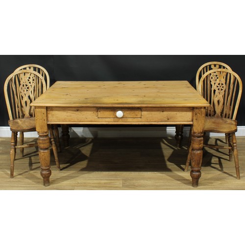 1340 - A late Victorian pine servants' quarters dining table, rectangular top above a single frieze drawer,... 