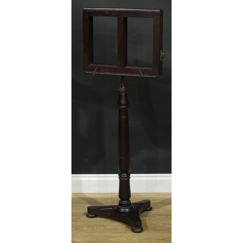 930 - A 19th century mahogany music stand, turned column, incurve triform base, bun feet, 113cm raising to... 