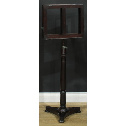 930 - A 19th century mahogany music stand, turned column, incurve triform base, bun feet, 113cm raising to... 