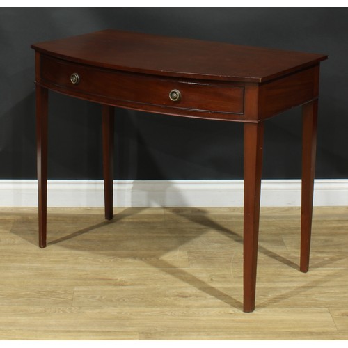 1105 - A George III mahogany bowfront side table, slightly oversailing top above a long cockbeaded frieze d... 