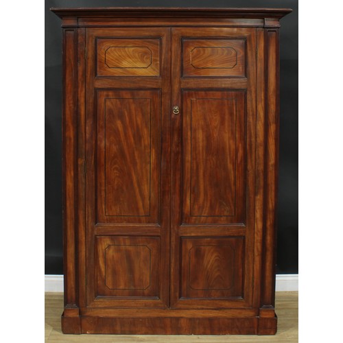 1239 - A George III mahogany wardrobe, possibly Channel Islands, moulded cornice above a pair of panel door... 